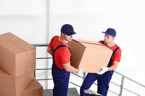 Professional movers handling furniture in Tottenham Hale