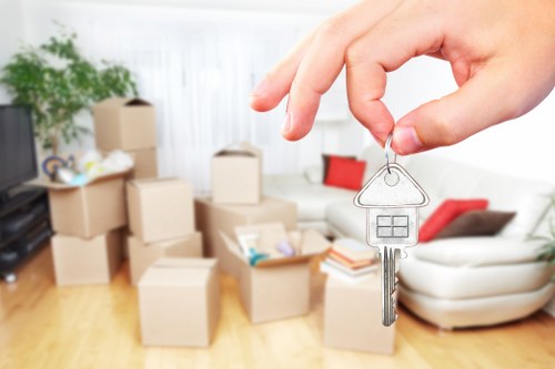 Professional house movers navigating flat access in Tottenham Hale