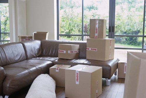 Packed boxes and furniture ready for collection in a local flat