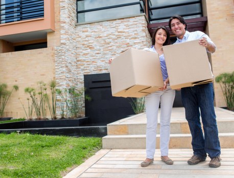 Removalists loading boxes and furniture for a house move in Tottenham Hale